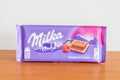 Milka alpine milk chocolate bar with raspberry creme Royalty Free Stock Photo