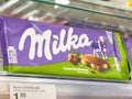 Milka chocolate bar in store display with hazelnuts and alpine milk Royalty Free Stock Photo