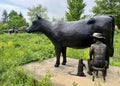 Milking a cow with a cat drinking milk Frederik Meijer Gardens & Sculpture Park