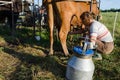 Milkmaid farmer woman milking machine pumps