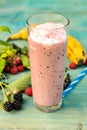 Milkshake with banana, raspberries blackberries and blackcurrants