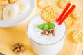 Milkshake (banana smoothie) with mint, nuts and cookies Royalty Free Stock Photo