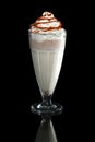Milkshake caramel summer cocktail isolated on black Royalty Free Stock Photo