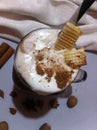 Milkshake with cream, spices, decorated with waffles and chocolate chips Royalty Free Stock Photo