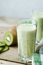 Milkshake kiwi in a glass with straws Royalty Free Stock Photo
