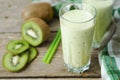 Milkshake kiwi in a glass with straws Royalty Free Stock Photo