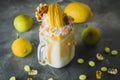 Milkshake with whipped cream, dripping sauce, macaroon and citrus Royalty Free Stock Photo