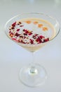 Milky rose cocktail with red petals