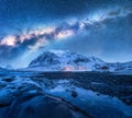 Milky Way above frozen sea coast and snow covered mountains Royalty Free Stock Photo