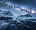 Milky Way above frozen sea coast and snow covered mountains Royalty Free Stock Photo