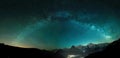 Milky Way arc and stars in night sky over the Swiss Alps with the famous alpen peaks Eiger, Monch and Jungfrau