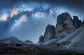 Milky Way arch and mountain peaks at night in summer