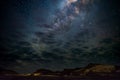 Milky Way arch, stars in the sky, the Namib desert in Namibia, Africa. Some scenic clouds. Royalty Free Stock Photo