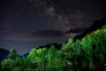 Milky Way with falling star above mountain peaks in National Park Valbona in Albania, Europe Royalty Free Stock Photo