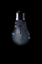Milky Way galaxy inside of light bulb on dark background Royalty Free Stock Photo