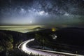 Milky Way Galaxy with lighting on the road at Doi inthanon Chiang mai, Long exposure photograph.With grain