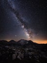 Milky Way galaxy and mountain peaks.