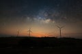 Milky way galaxy over wind turbine clean energy Royalty Free Stock Photo