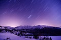 Milky Way Galaxy. Purple night sky stars above mountains Royalty Free Stock Photo