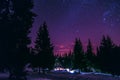 Milky Way Galaxy. Purple night sky stars above mountains Royalty Free Stock Photo