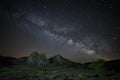 The Milky Way Galaxy rising above rocky landscape