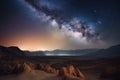 milky way galaxy, shining brightly in the night sky over desert landscape Royalty Free Stock Photo