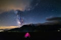 Milky way galaxy stars over the Alps, camping illuminated tent, Mars and Jupiter planet, snowcapped mountain range, astro night sk