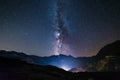 The Milky way galaxy and stars over the Italian French Alps. Night sky on majestic snowcapped mountains and glaciers. Meteor Royalty Free Stock Photo