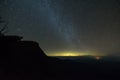 The milky way illuminated above the dark silhouette of the mountain Royalty Free Stock Photo