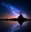 Milky Way and man on the rock. Galaxy, Universe Royalty Free Stock Photo
