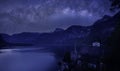 Milky way in the night with famous Hallstatt mountain village with Hallstaetter Lake in the Austrian Alps Royalty Free Stock Photo