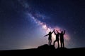 Milky Way. Night sky and silhouette of a family Royalty Free Stock Photo