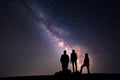 Milky Way. Night sky and silhouette of a family Royalty Free Stock Photo