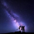 Milky Way. Night sky with silhouette of a happy family Royalty Free Stock Photo