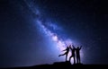 Milky Way. Night sky with silhouette of a happy family Royalty Free Stock Photo