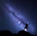 Milky Way. Night sky with stars and silhouette of a man Royalty Free Stock Photo