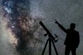 Milky Way. Night sky with stars and silhouette of a standing man Royalty Free Stock Photo