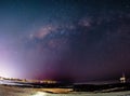 Milky way over city lights