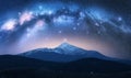 Milky Way over Goverla mountain with snow covered peak at night Royalty Free Stock Photo