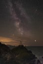 The Milky Way over Llanddwyn island lighthouse, Twr Mawr at Ynys Llanddwyn on Anglesey Royalty Free Stock Photo