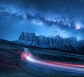 Milky Way over mountain road at night in summer Royalty Free Stock Photo