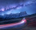 Milky Way over mountain road at night in summer Royalty Free Stock Photo