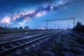Milky Way over the railway station at starry night