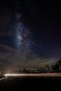 Milky Way over the road at night. Long exposure photograph Royalty Free Stock Photo