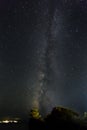 The Milky Way rising up above a lone pine tree Royalty Free Stock Photo