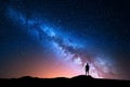 Milky Way and silhouette of alone man. Night landscape Royalty Free Stock Photo