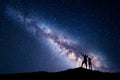 Milky Way and silhouette of happy people Royalty Free Stock Photo