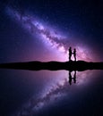 Milky Way with silhouette of people. Landscape with night sky Royalty Free Stock Photo