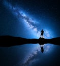 Milky Way and silhouette of a standing alone man Royalty Free Stock Photo