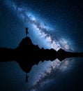 Milky Way with silhouette of a standing woman practicing yoga Royalty Free Stock Photo